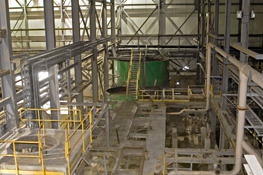 Inside of the Mount Pleasant mill, showing the (green) tungsten thickener tank in the flotation area.