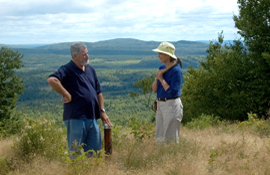 Adex mine site manager Roger Young (left) and visiting geologist beside a collared drillhole from the mid-2008 drilling program at the Fire Tower Zone, Mount Pleasant.